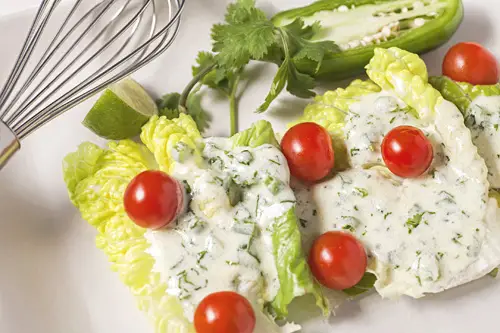 Cuaresmenos Creamy Dressing served over lettuces