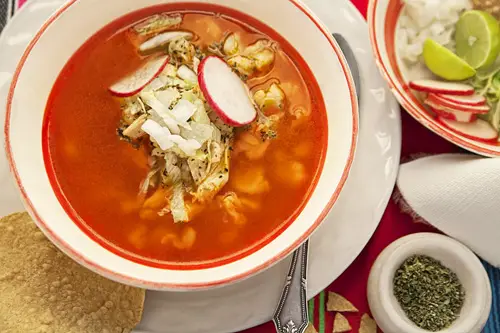 Red Pozole with Chicken accompanied with many ingredients